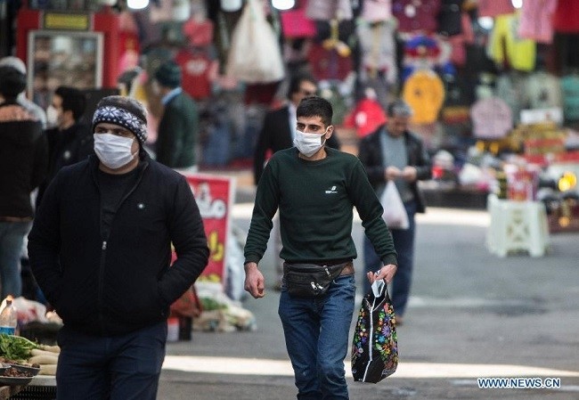 People wearing face masks are seen at a bazaar in Ramsar, Iran, on Dec. 9, 2020. (Photo: Xinhua)