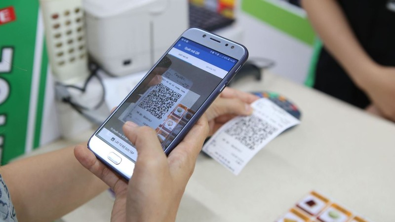 EVN customers can scan a QR code to pay their electricity bills from next year.