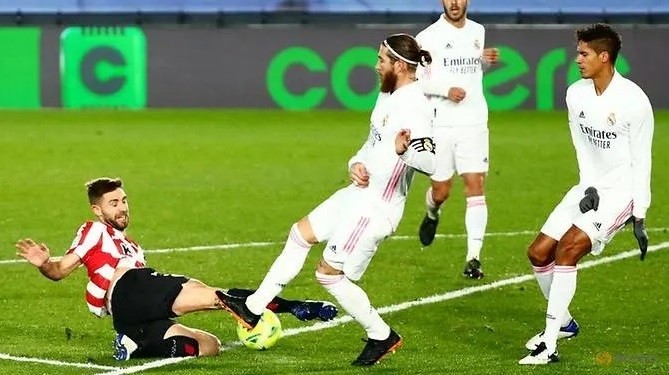 Real Madrid's Sergio Ramos in action with Athletic Bilbao's Inigo Martinez. (Reuters)