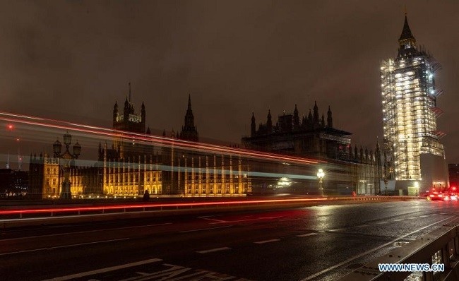 Vehicles drive past the Houses of Parliament in London, Britain, Dec. 23, 2020. Britain and the European Union (EU) have reached a deal on their post-Brexit trade relations, British media reported here Thursday. (Photo: Xinhua)