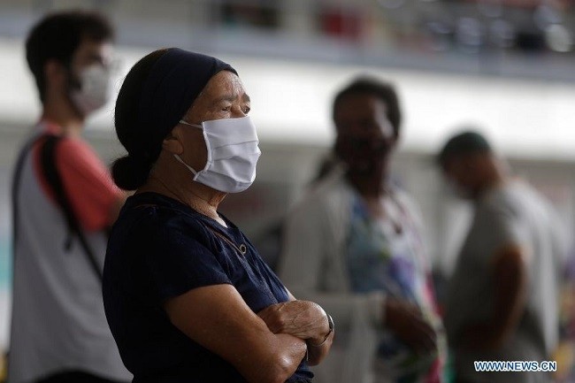 People wearing face masks wait for buses at the central bus station in Brasilia, Brazil, Dec. 23, 2020. Totoal confirmed COVID-19 cases in Brazil have reached 7,365,517, according to the latest updates by the Center for Systems Science and Engineering at Johns Hopkins University at 1500 GMT, Wednesday. (Photo: Xinhua)
