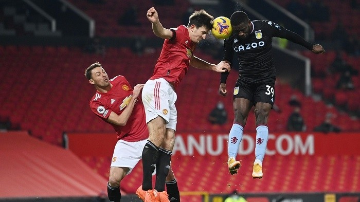 Soccer Football - Premier League - Manchester United v Aston Villa - Old Trafford, Manchester, Britain - January 1, 2021 Aston Villa's Keinan Davis in action with Manchester United's Nemanja Matic and Harry Maguire. (Photo: Pool via Reuters)