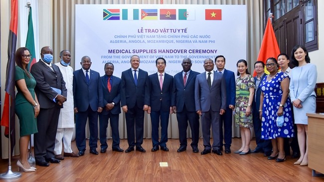 Participants at a medical supplies handover ceremony from Vietnam to assist several African countries in their fight against COVID-19.