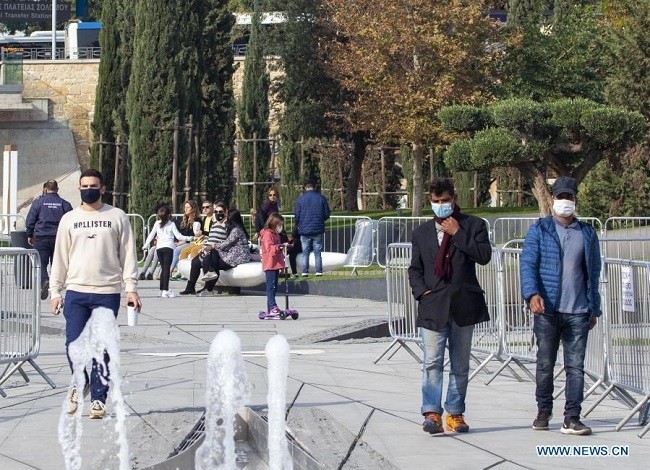 People wearing face masks walk on a square in Nicosia, Cyprus, on Jan. 4, 2021. Cyprus has detected 12 cases of the new coronavirus variant in people who had arrived from the UK, the Health Ministry said on Jan. 3. (Photo: Xinhua)