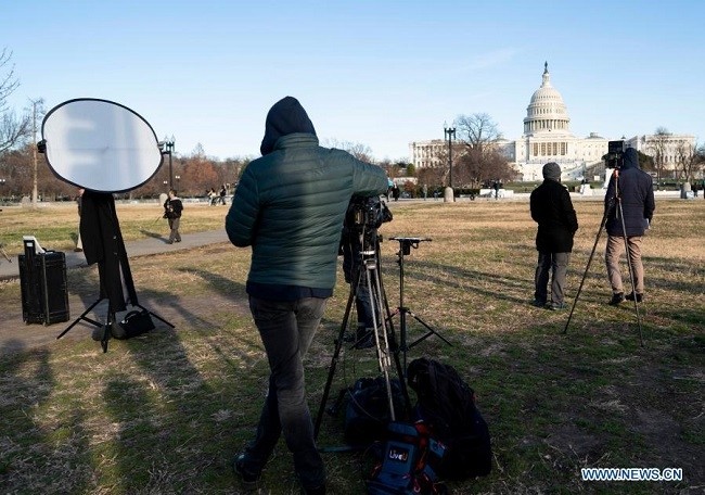 Journalists work near the UCapitol building a day after supporters of US President Donald Trump stormed it in Washington, D.C., the United States, Jan. 7, 2021. (Photo: Xinhua)