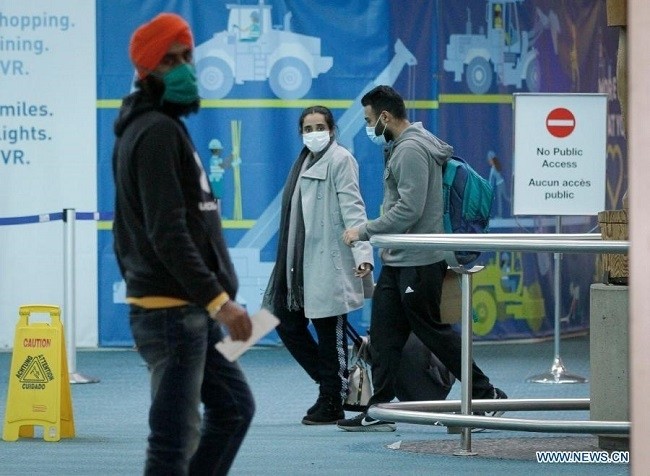 Passengers wearing face masks are seen as they walk out of the arrival hall at the Vancouver International Airport in Richmond, British Columbia, Canada, Jan. 6, 2021. Canada continues to see increasing numbers of COVID-19 cases as the country reported a total of 626,174 cases and 16,361 deaths as of Wednesday evening, according to CTV. (Photo: Xinhua)