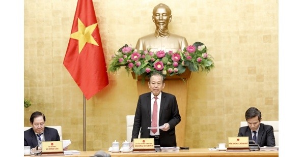 Deputy PM Truong Hoa Binh (standing) speaks at the conference. (Photo: VGP)