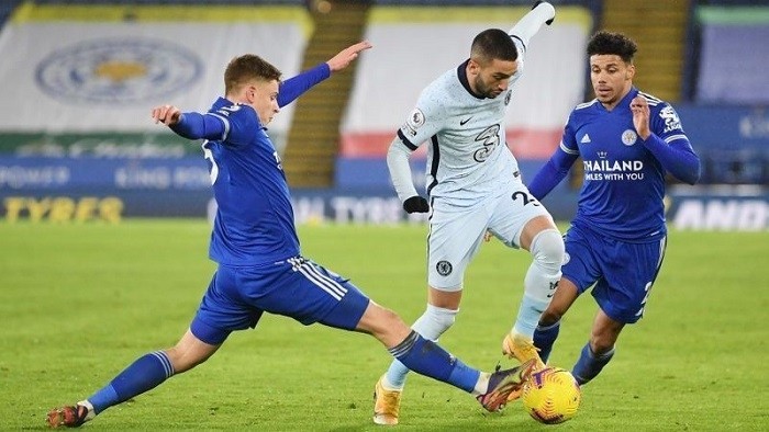Soccer Football - Premier League - Leicester City v Chelsea - King Power Stadium, Leicester, Britain - January 19, 2021 Leicester City's Harvey Barnes and James Justin in action with Chelsea's Hakim Ziyech. (Photo: Pool via Reuters)