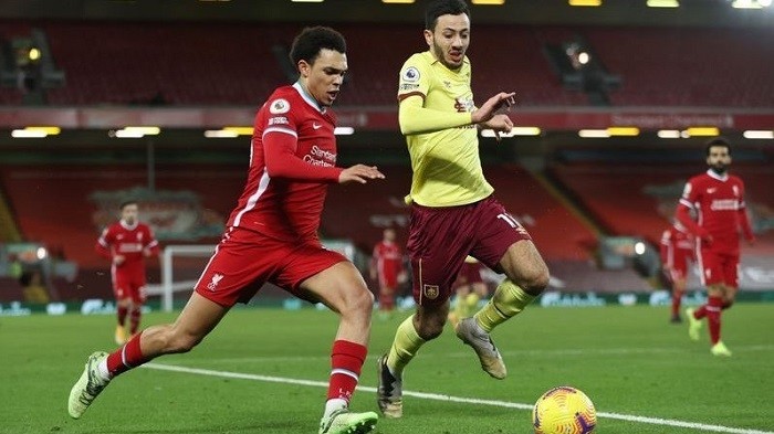 Soccer Football - Premier League - Liverpool v Burnley - Anfield, Liverpool, Britain - January 21, 2021 Liverpool's Trent Alexander-Arnold in action with Burnley's Dwight McNeil. (Photo: Pool via Reuters)