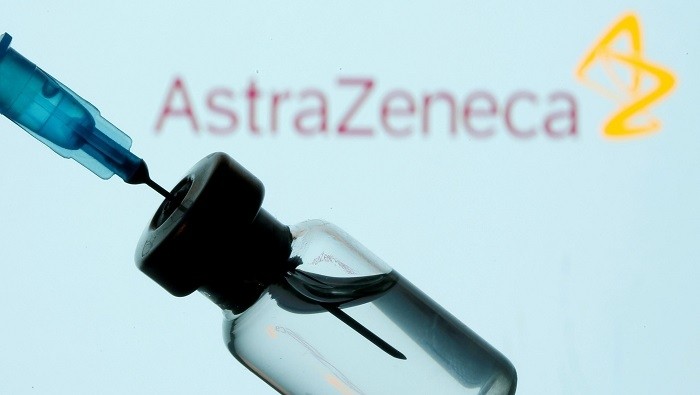 A vial and syringe are seen in front of a displayed AstraZeneca logo in this illustration taken January 11, 2021. (Photo: Reuters)