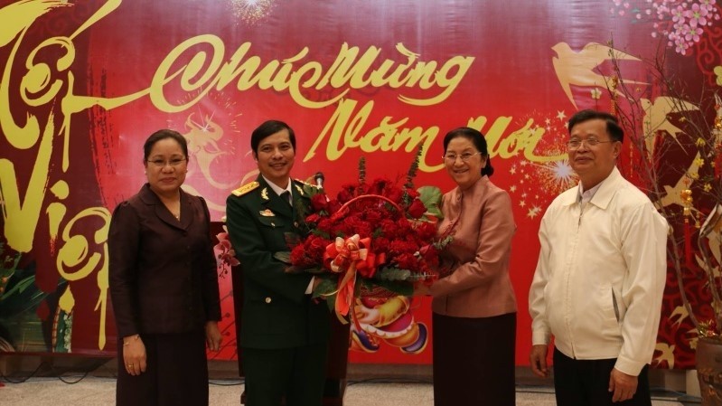Lao National Assembly Chairwoman Pany Yathotou extends Lunar New Year greetings to Vietnamese soldiers.