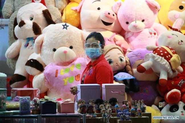 A saleswoman tends to a shop of stuffed toys at a supermarket in Nay Pyi Taw, Myanmar, Feb. 5, 2021. (Photo: Xinhua)