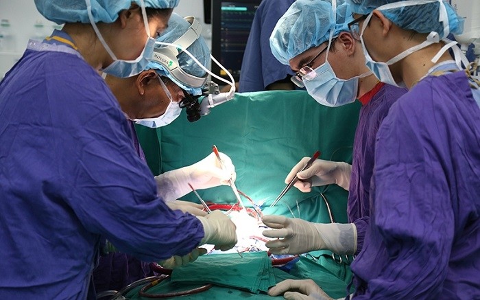 Doctors at Hanoi's Viet Duc (Vietnam-Germany) Friendship Hospital performing a heart transplant on a seven-year-old child.