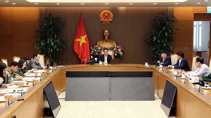 Deputy Prime Minister Vu Duc Dam chairs the meeting of the National Steering Committee for COVID-19 Prevention and Control on Mar 26.