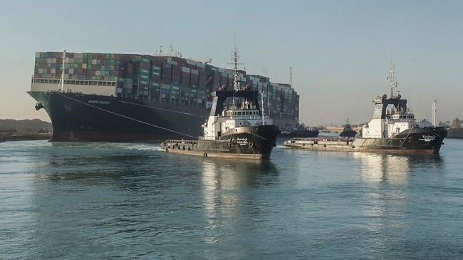Ship swings back across Suez Canal before next tugging attempt, witness and source say