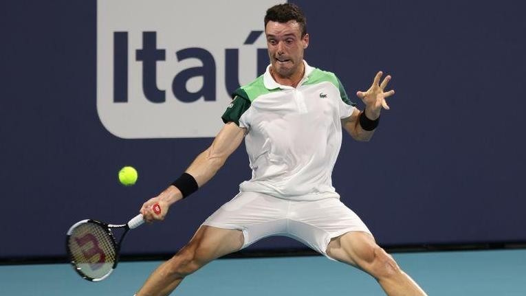 Mar 31, 2021; Miami, Florida, USA; Roberto Bautista Agut of Spain hits a forehand against Daniil Medvedev of Russia (not pictured) in a men's singles quarterfinal in the Miami Open at Hard Rock Stadium. (Photo: USA TODAY Sports)