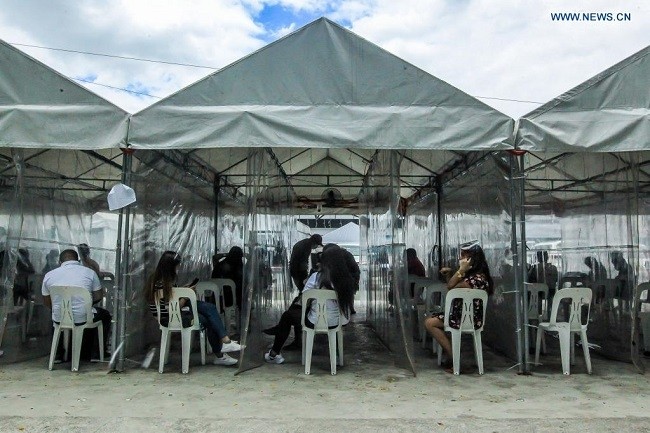 People wait to have COVID-19 tests at a COVID-19 testing site in Manila, the Philippines, April 10, 2021. (Photo: Xinhua)