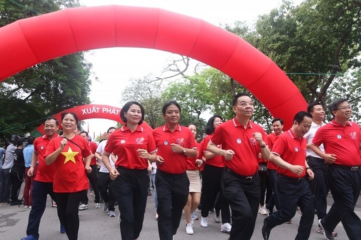 Delegates participate in the Olympic Run Day for Public Health in Hanoi on April 24.