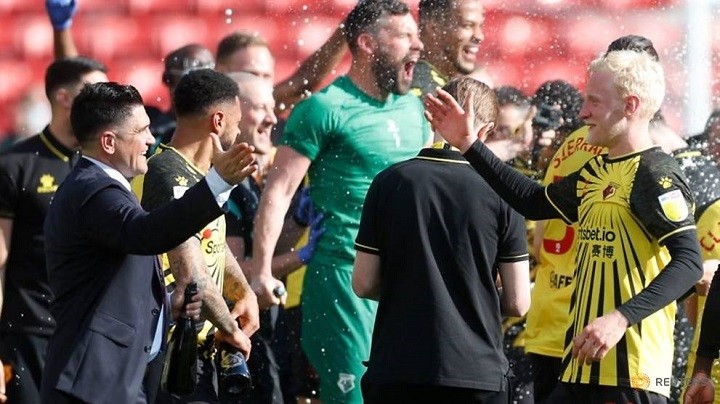 Soccer Football - Championship - Watford v Millwall - Vicarage Road, Watford, Britain - April 24, 2021 Watford's Will Hughes and manager Xisco Munoz celebrate promotion to the Premier League after the match. (Photo: Reuters)