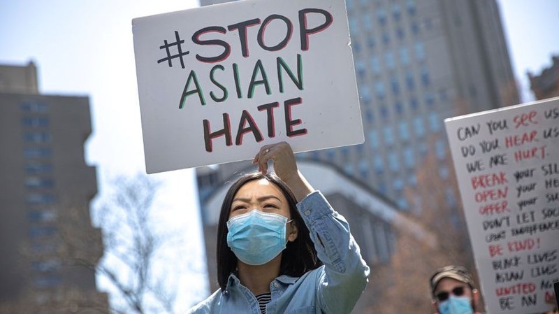 A woman holds a placard as she participates in a Stop Asian Hate rally at Columbus Park in New York City, U.S., April 3, 2021. (Photo: Reuters)