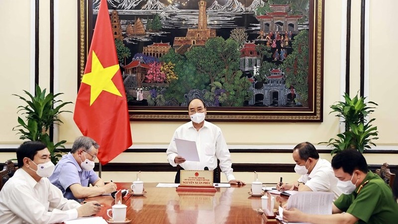 President Nguyen Xuan Phuc at the working session (Photo: VNA) 