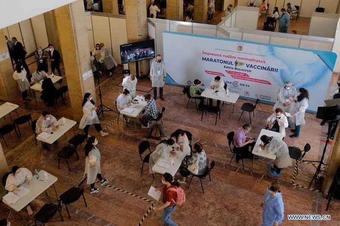 People register to get vaccinated during a "vaccination marathon" at Palace Hall in Bucharest, Romania, on May 7, 2021. Romania's largest "vaccination marathon," aimed at further boosting COVID-19 jab rollout in the country, kicked off here Friday. (Photo: Xinhua)