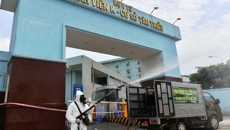 A worker disinfects the Tan Trieu branch of the National Cancer Hospital in Hanoi.
