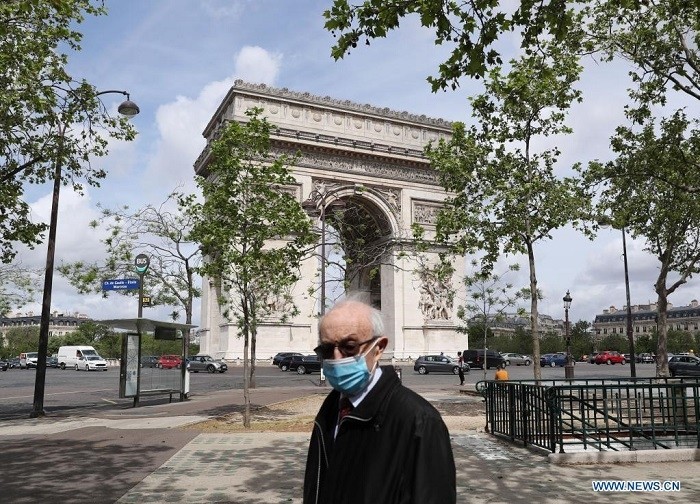 A man wearing a mask walks near the Arc de Triomphe in Paris, France, May 12, 2021. France is on its way to coming out of the health crisis as COVID-19 indicators continue the downward trend and vaccine rollout is speeding up, according to French Prime Minister Jean Castex. (Photo: Xinhua)