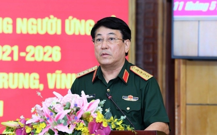 Politburo member and Chairman of the General Department of Politics under the Vietnam People’s Army Luong Cuong speaks during his meeting with Thanh Hoa voters on May 11.