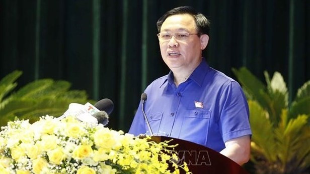 NA Chairman Vuong Dinh Hue presents his action plan (Photo: VNA)