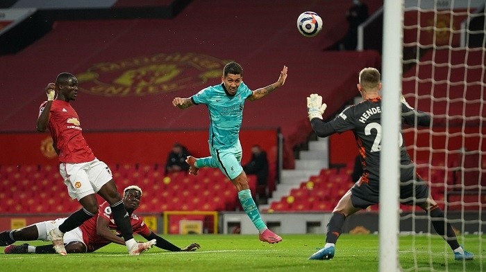 Soccer Football - Premier League - Manchester United v Liverpool - Old Trafford, Manchester, Britain - May 13, 2021 Liverpool's Roberto Firmino scores their second goal. (Photo: Pool via Reuters)