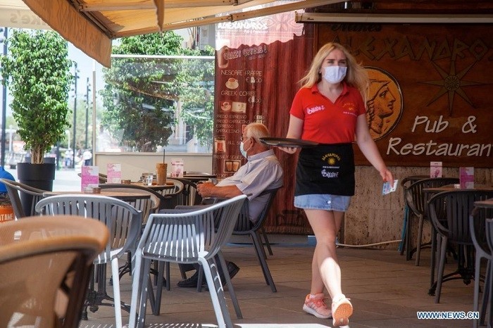 A waitress wearing a face mask is seen in a coffee shop in downtown Nicosia, Cyprus on May 10, 2021. The Health Ministry of Cyprus issued a decree Monday, easing most coronavirus-related restrictions and introducing a SafePass for shops, restaurants and crowded events as well as on buses. (Image for illustration/ Source: Xinhua)