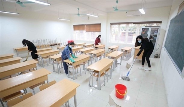A classroom is being disinfected during students halting going to school due to COVID-19 outbreak in many cities and provinces across the country. (Photo: VNA)