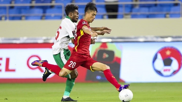 Vietnam's Phan Van Duc (in red) in action during their Group G match against Indonesia in the World Cup Asian qualifiers on June 7. (Photo: AFC)