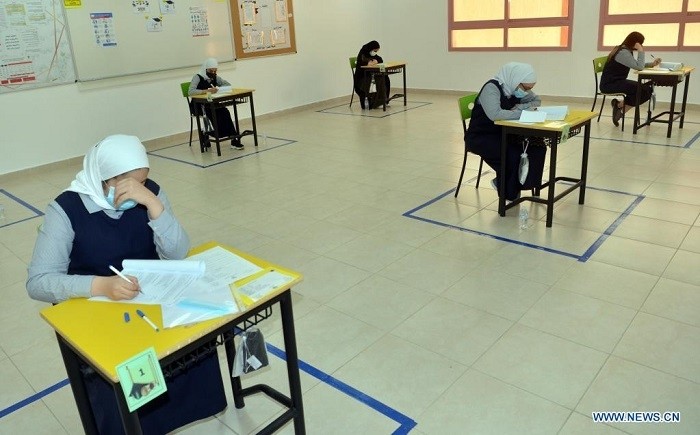 Grade 12 students take exams in Hawalli Governorate, Kuwait, June 9, 2021. Kuwaiti students of Grade 12 began on Wednesday their paper exams with full health compliance and strict precautions across the country. (Photo: Xinhua)
