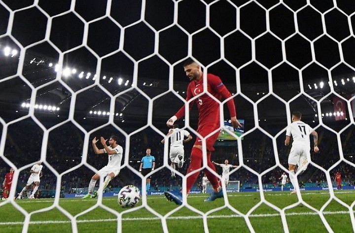 Soccer Football - Euro 2020 - Group A - Turkey v Italy - Stadio Olimpico, Rome, Italy - June 11, 2021 Turkey's Okay Yokuslu looks dejected after Merih Demiral scores an own goal and the first for Italy as Italy's Domenico Berardi, Manuel Locatelli and Ciro Immobile celebrate. (Photo: Reuters)
